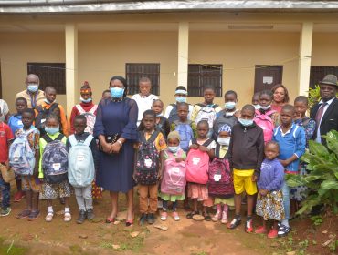 Internally Displaced Children as they receive School kits